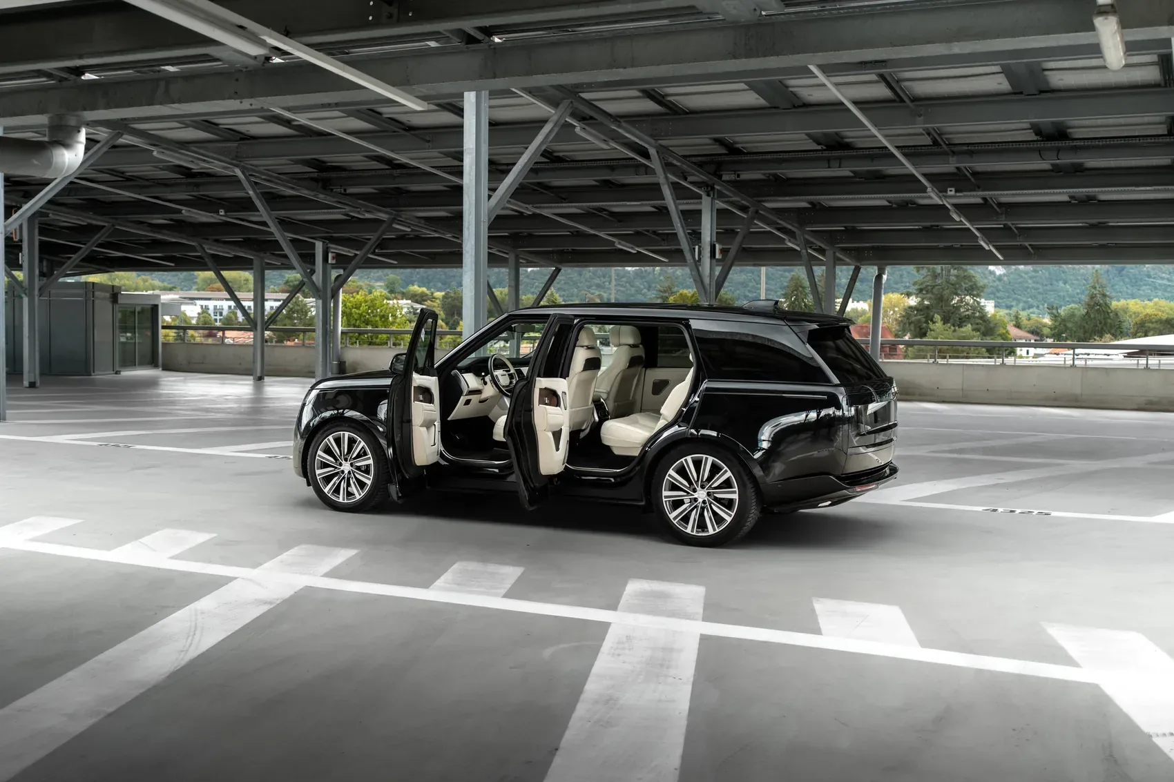 Open doors, access to the beige leather cabin